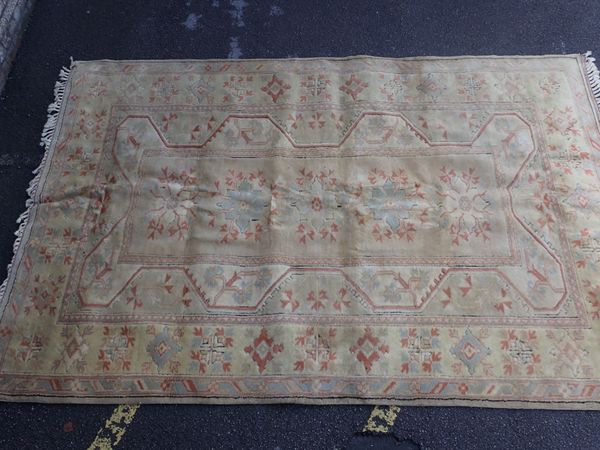 A TURKISH ANADOL RUG, IN MUTED COLOURS