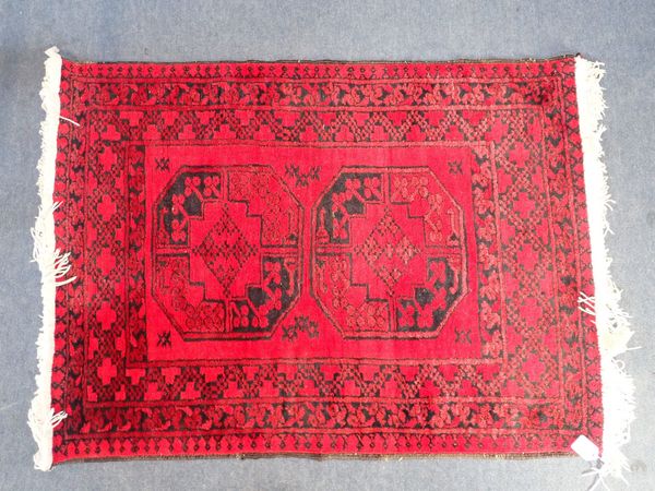 A RED GROUND RUG