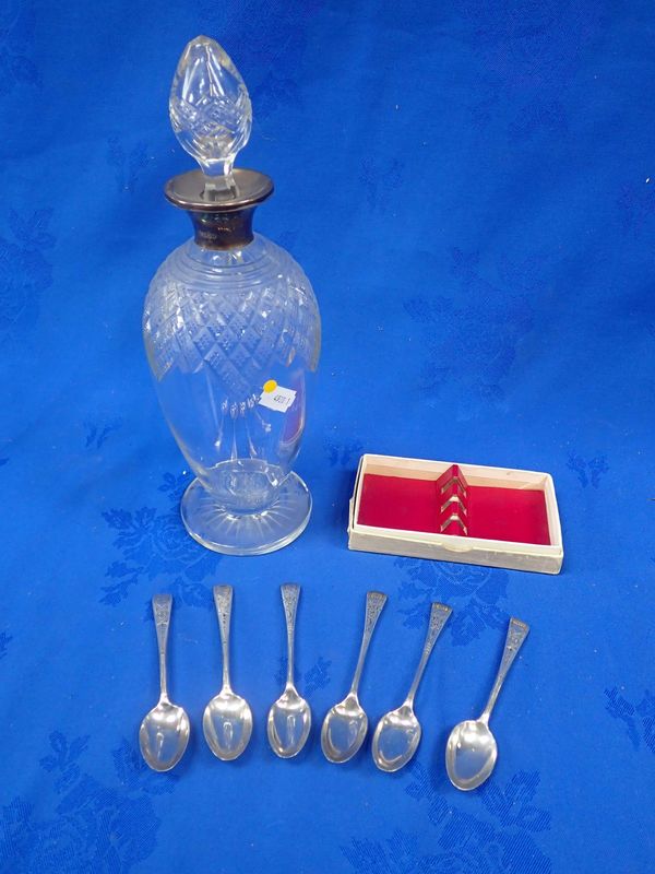 A SILVER COLLARED CUT-GLASS DECANTER