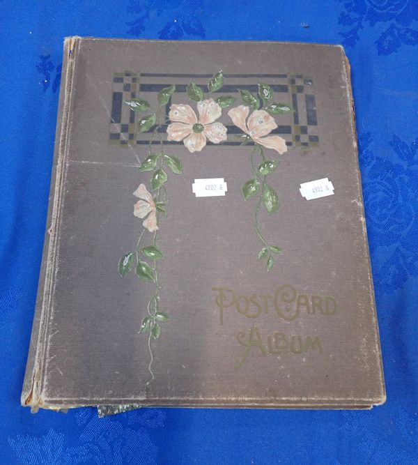 AN EARLY 20TH CENTURY GREY CLOTH POSTCARD ALBUM OF CANADIAN INTEREST