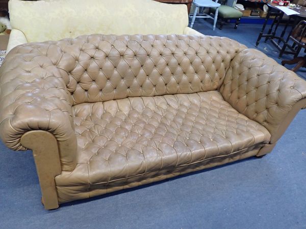 A  PALE LEATHER BUTTONED CHESTERFIELD