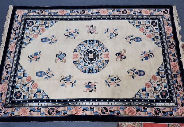 A CHINESE PEKING RUG, BLUE ON CREAM GROUND