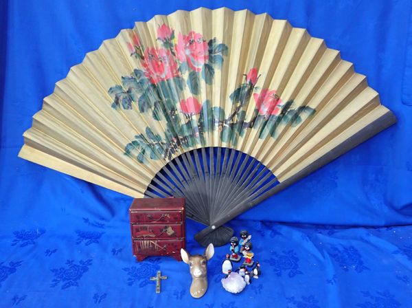 A SMALL LAQUERED TABLE CABINET, A LARGE JAPANESE FAN