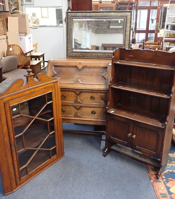 A GEORGE III OAK HANGING CORNER CABINET