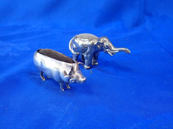 A SILVER PIG PINCUSHION