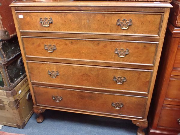 A FIGURED WALNUT AND MAHOGANY CHEST OF DRAWERS