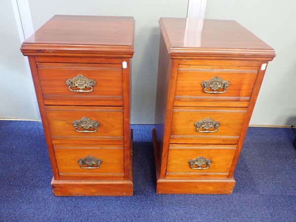 A PAIR OF WALNUT BEDSIDE CHESTS