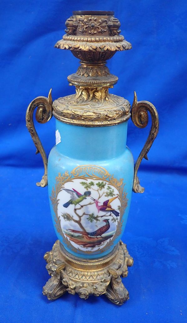 A 19TH CENTURY FRENCH CERAMIC AND ORMOLU OIL LAMP