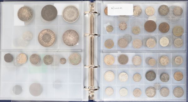 A COIN ALBUM CONTAINING MIXED WORLD COINS