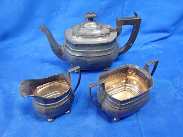 A GEORGE III STYLE THREE-PIECE SILVER TEA SET