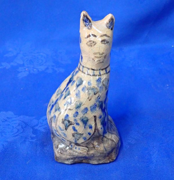 A NAIVELY POTTED PERSIAN POTTERY CAT