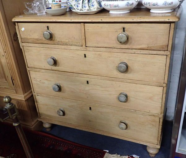 A VICTORIAN STRIPPED PINE CHEST DRAWERS