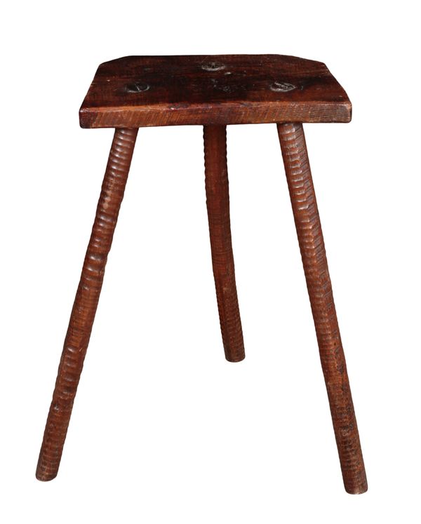 AN EARLY 19TH CENTURY ELM THREE LEGGED STOOL