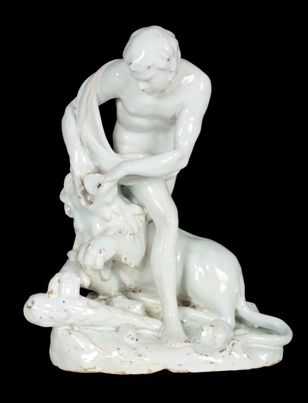 A LATE 17TH CENTURY ITALIAN TIN GLAZED TERRACOTTA FIGURE, HERCULES SLAYING THE NEMEAN LION