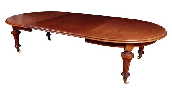 A VICTORAN MAHOGANY OVAL EXTENDING DINING TABLE