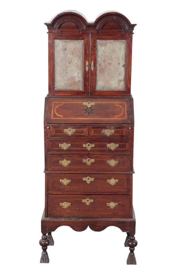 AN EARLY 18TH CENTURY STYLE OAK BUREAU ON STAND OF SMALL PROPORTIONS