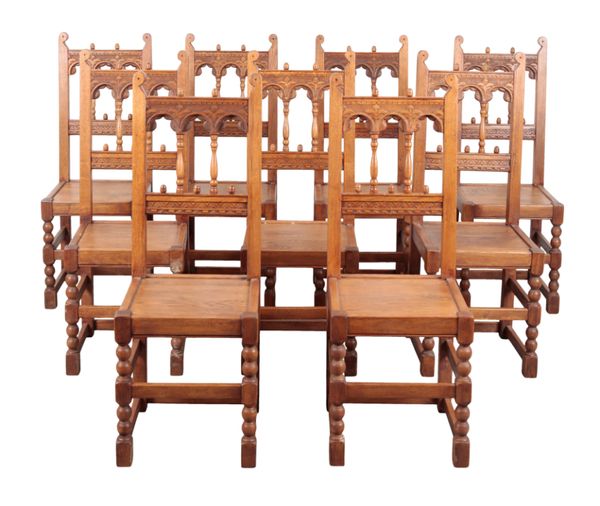 A SET OF TEN OAK HIGH BACK DINING CHAIRS