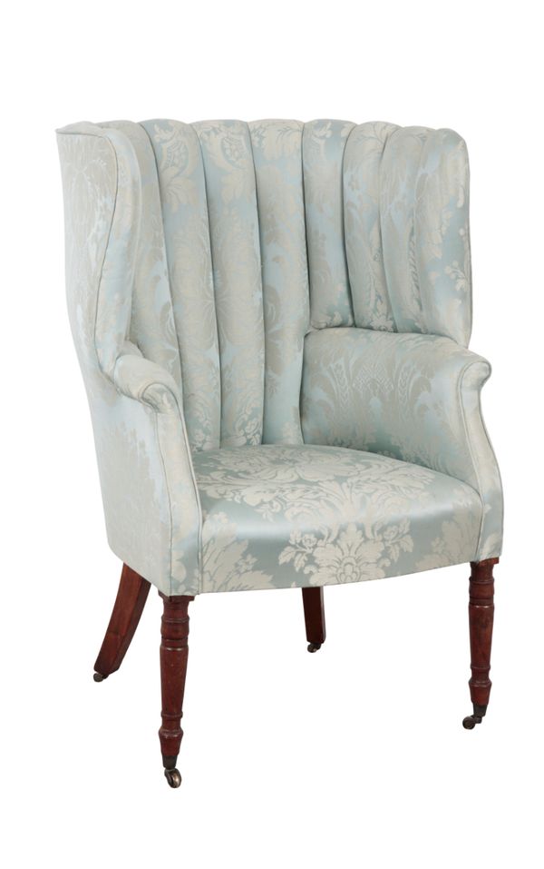 AN EARLY 19TH CENTURY BARREL BACK ARMCHAIR