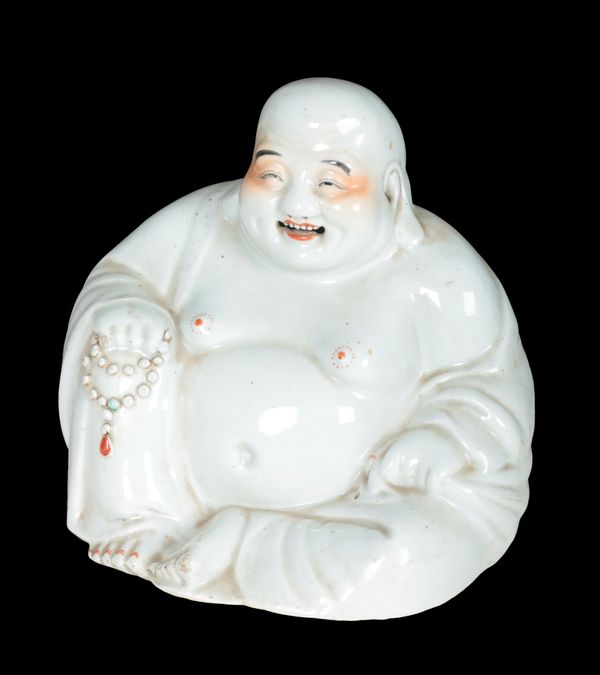 A BLANC DE CHINE PORCELAIN MODEL OF A BUDDHA