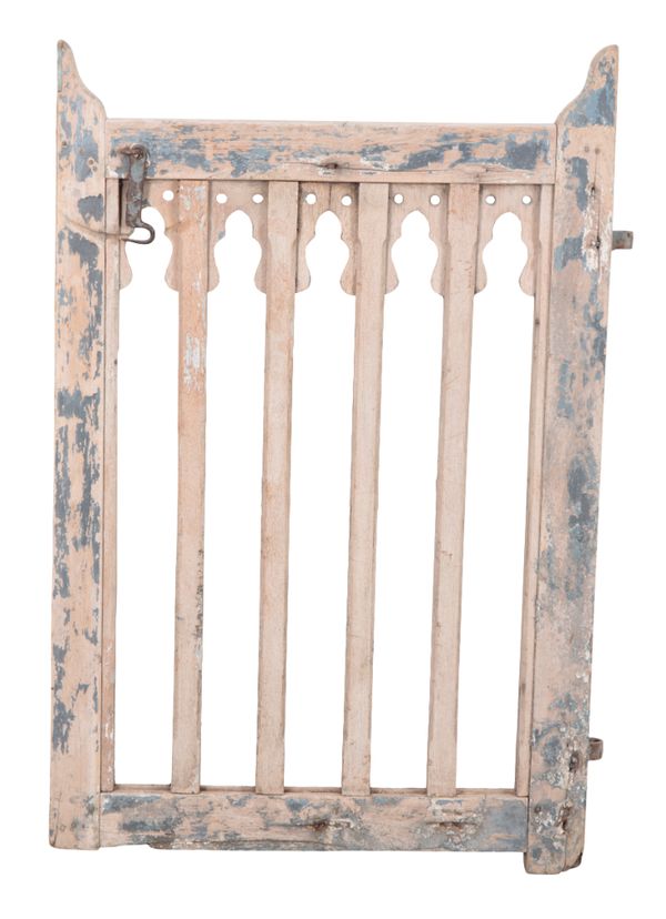 A PAINTED AND DISTRESSED WOODEN GATE
