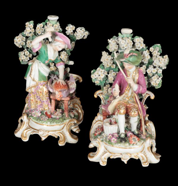 A PAIR OF 18TH CENTURY DUESBURY & CO DERBY PORCELAIN CANDLESTICKS - A DOMESTIC COUPLE