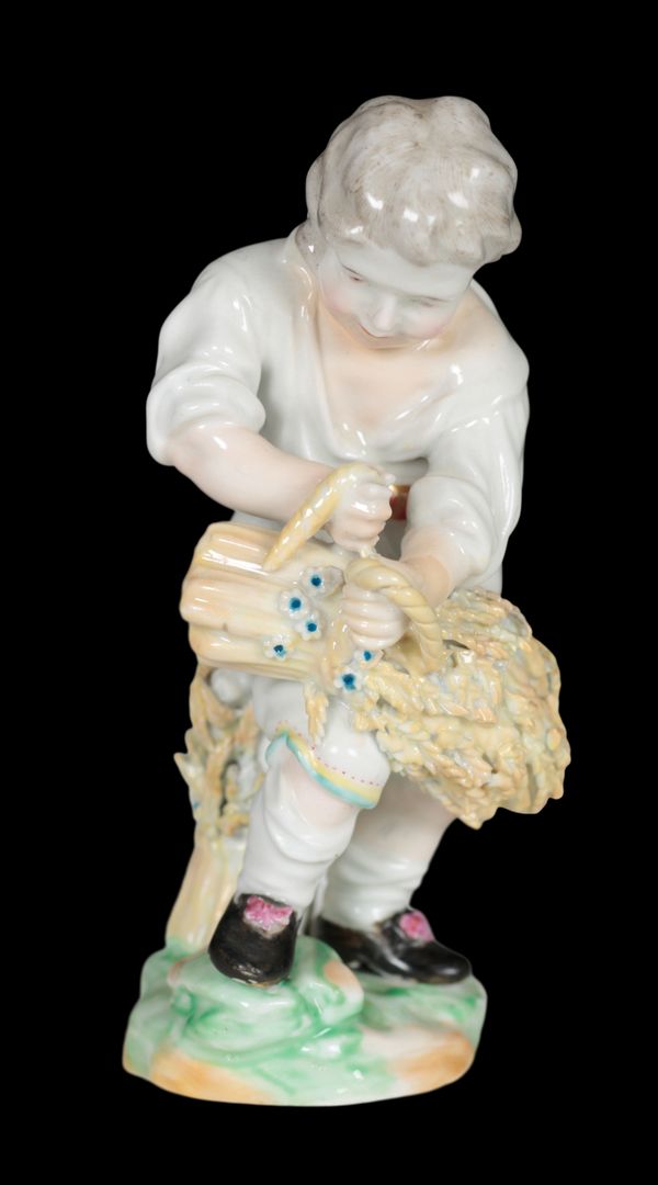 AN 18TH CENTURY DUESBURY & CO DERBY PORCELAIN FIGURE - BOY BALING WHEAT SHEAVES