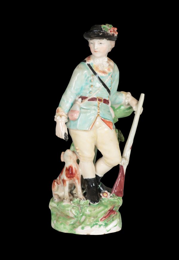 AN 18TH CENTURY DUESBURY & CO DERBY PORCELAIN FIGURE - SPORTSMAN WITH DOG AT FOOT