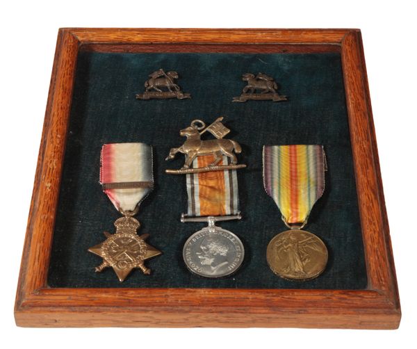 A CONTEMPORARILY FRAMED 1914 STAR BAR TRIO