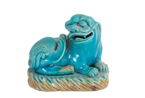 A CHINESE PORCELAIN TURQUOISE GLAZED LION DOG