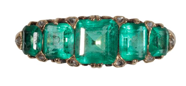 A FIVE STONE EMERALD RING