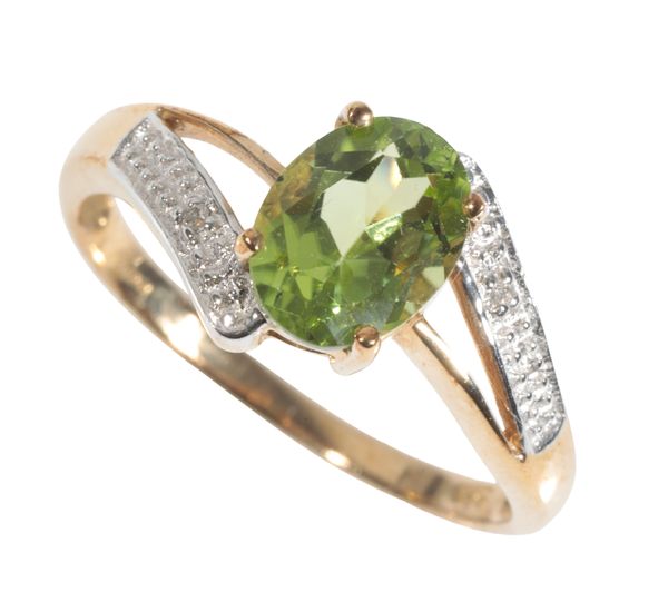 A PERIDOT AND DIAMOND CROSSOVER RING