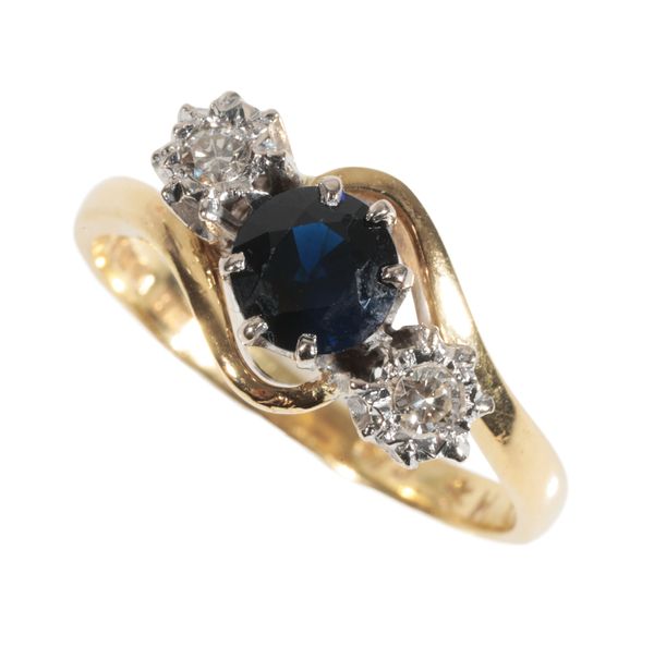 A SAPPHIRE AND DIAMOND CROSSOVER RING