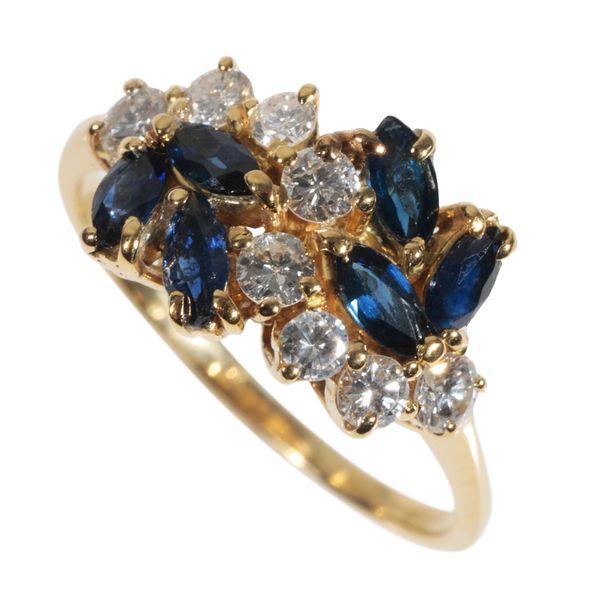 A SAPPHIRE AND DIAMOND CLUSTER RING