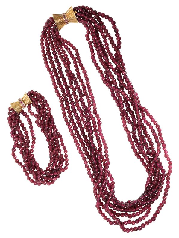 A "RUBY" MULTI-STRAND BEADED NECKLACE AND BRACELET