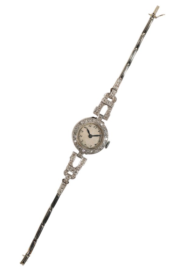 A LADY'S PLATINUM AND DIAMOND COCKTAIL WATCH