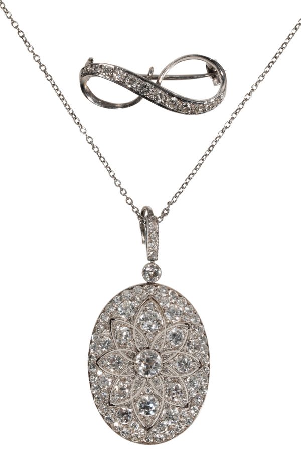 AN EDWARDIAN DIAMOND-SET CRYSTAL BACK LOCKET PENDANT/BROOCH