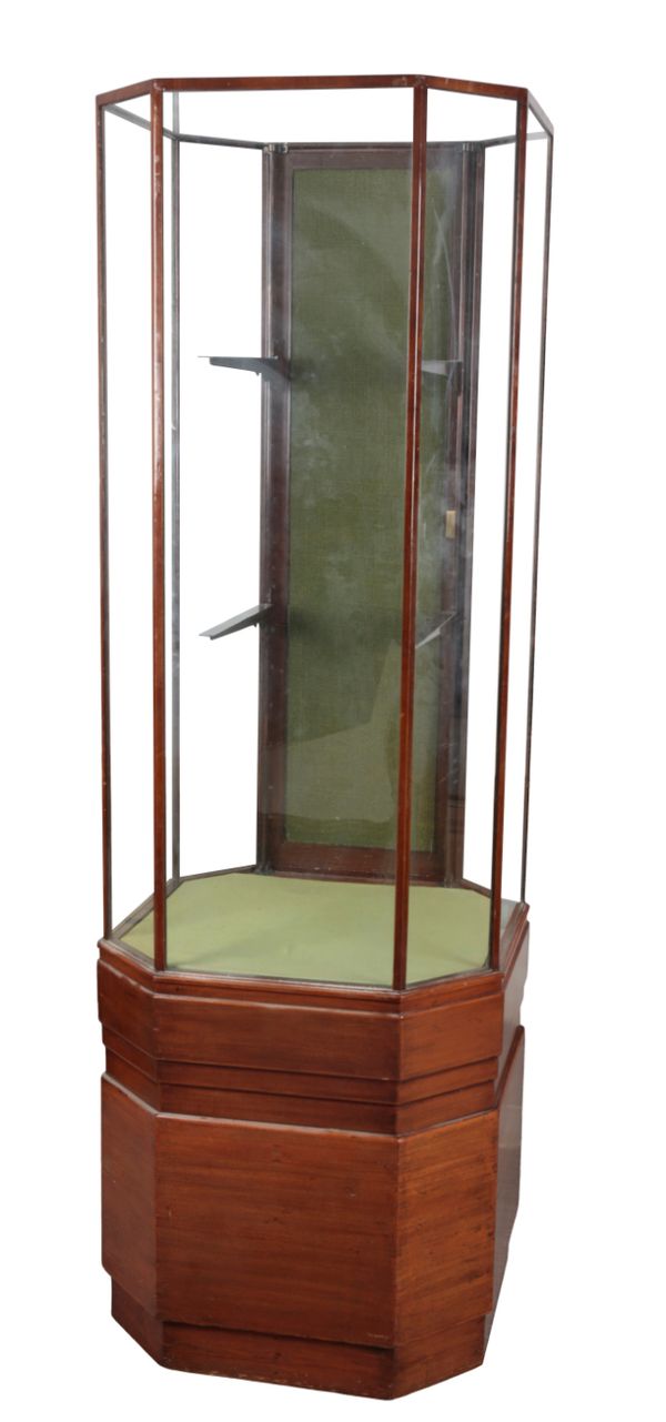 AN ART DECO MAHOGANY OCTAGONAL DISPLAY CASE