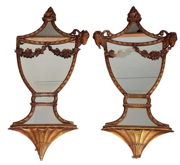 A PAIR OF REGENCY STYLE GILTWOOD AND COMPOSITION URN SHAPED MIRRORS