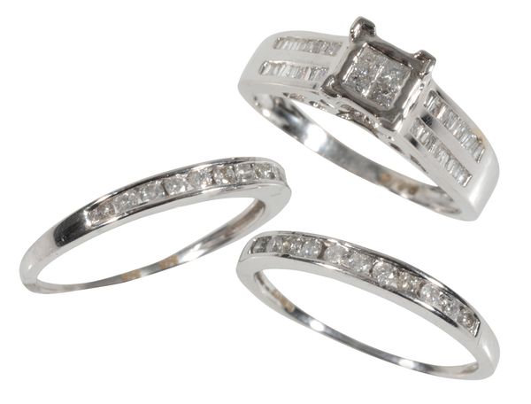 THREE 9CT GOLD DIAMOND RINGS