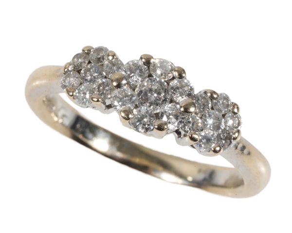 A TRIPLE DIAMOND FLOWERHEAD RING