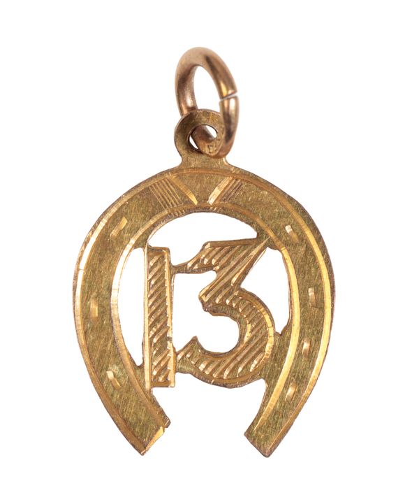 A 9CT GOLD HORSE SHOE PENDANT