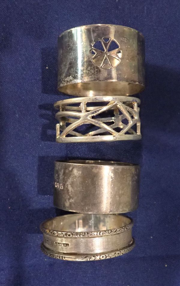 FOUR SILVER NAPKIN RINGS