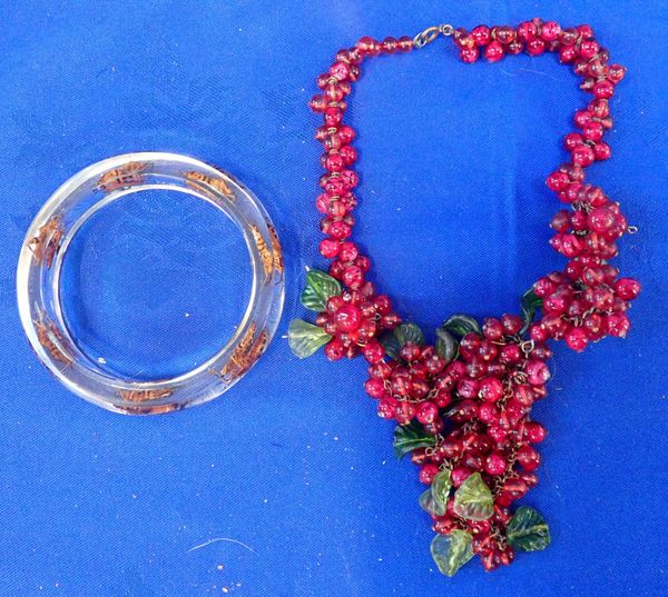 A LUCITE INSECT BANGLE