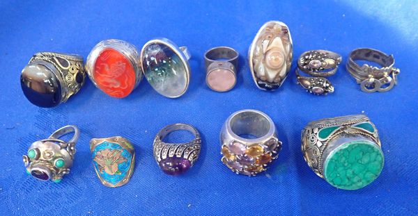 A COLLECTION OF INDIAN STYLE CHUNKY WHITE METAL RINGS