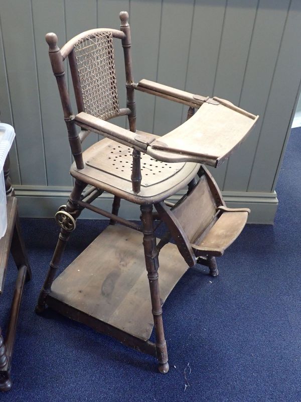 AN OAK AND CANE VINTAGE CHILD'S HIGHCHAIR