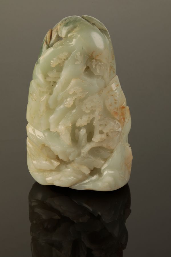 A CHINESE CELADON JADE BOULDER CARVED AS A MOUNTAIN