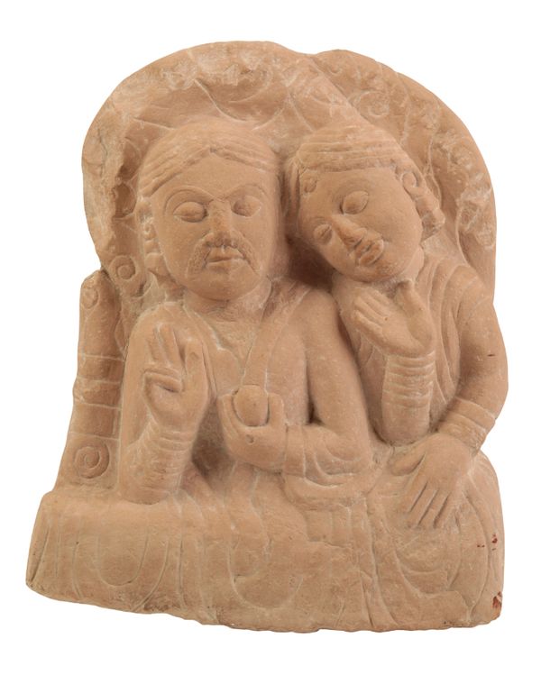 AN INDIAN PINK SANDSTONE CARVED STELE OF RADHA AND KRISHNA