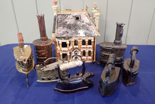 A CERAMIC MODEL OF A  VICTORIAN HOUSE