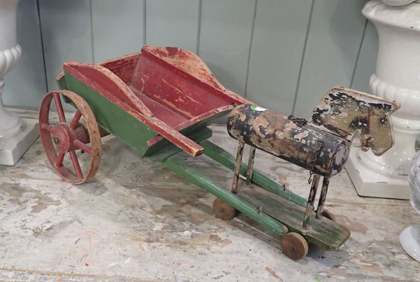 A FOLKART PAINTED HORSE AND CART