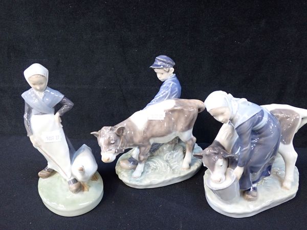 THREE COPENHAGEN PORCELAIN FIGURES - TWO CALVES WITH HANDLERS AND ‘GOOSE GIRL’